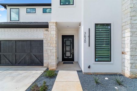 Doorway to property with a garage