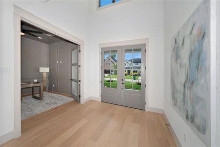 Grand Foyer Entrance. Study located on the right side of the house with double doors.