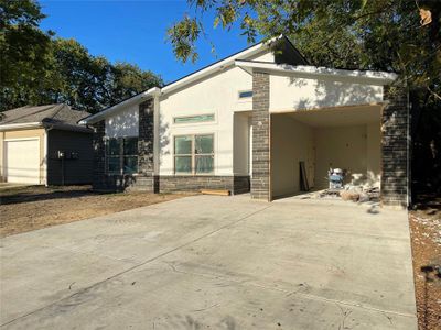 View of front of property featuring a garage