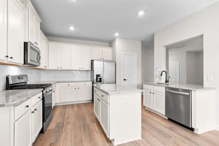 Kitchen with upgraded Whirlpool kitchen appliances.