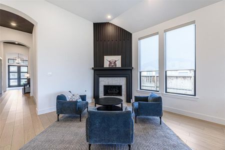 The den is the perfect entertainment setting with a modern fireplace as the main feature!