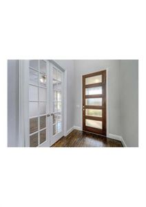 Foyer entrance with a wealth of natural light, french doors, and dark wood-type flooring