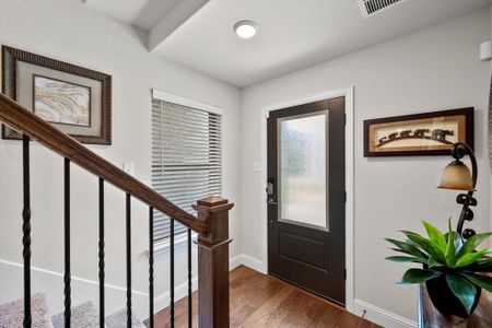 Foyer with hardwood / wood-style floors