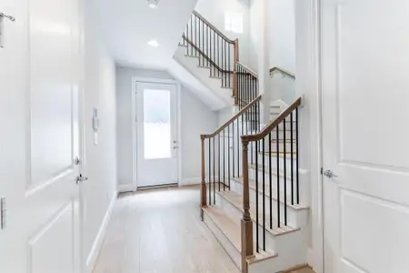 Grand entrance with this sweeping staircase.