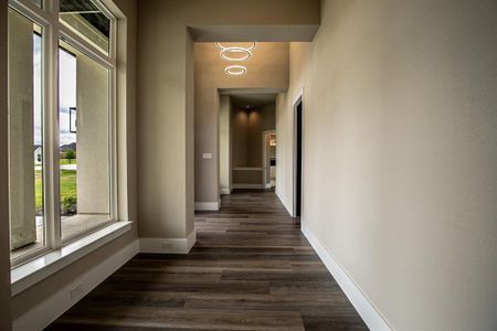 Front hallway separating primary bedroom from the rest of the house