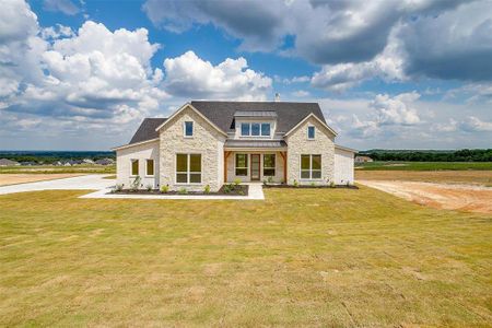 View of front of property with a front lawn