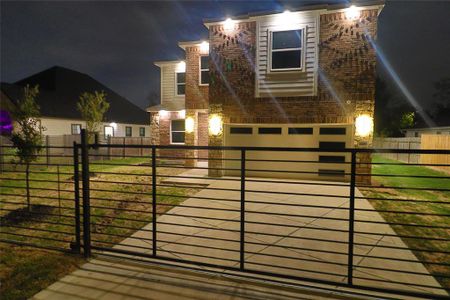 The exterior of this home features custom brick design to match stamped concrete driveway, 6ft wrought iron front fence w/sliding gate to match which is also pre-wire for a gate opener and 360 degree led soffit lighting w/ smart led color changing lights compatible with google assistant or amazon alexa.