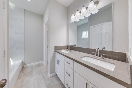 The tile in the shower is absolutely stunning! This beautiful design elevates the space while offering both style and functionality. Whether you prefer a quick, invigorating shower or a relaxing soak in the tub, the convenient shower and bath combo caters to all your needs.