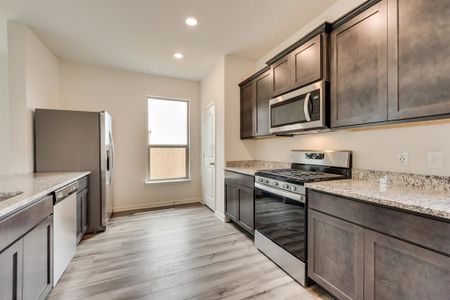 The kitchen of the Reed plan comes chef-ready from the day you move-in! Highlighted by a full suite of stainless steel appliances and sparkling granite countertops, you will love preparing your family’s favorite meals and treats in this spacious room.