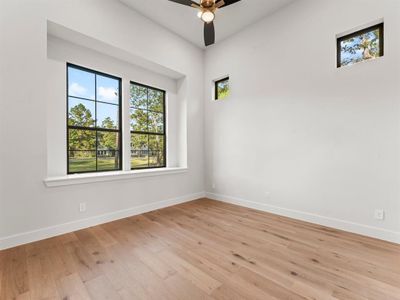 Study/Home Office with Double Doors, Engineered Hardwood Flooring, and Natural Light