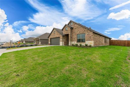 View of front facade with a front lawn and a garage