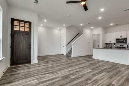 Foyer with light wood-type flooring, sink, and ceiling fan