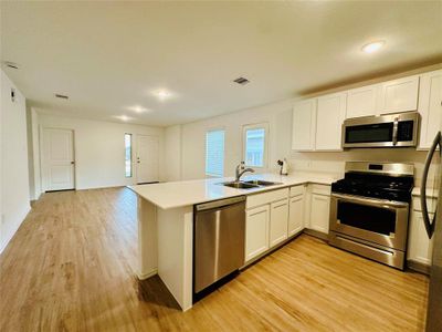 Kitchen with view of living room