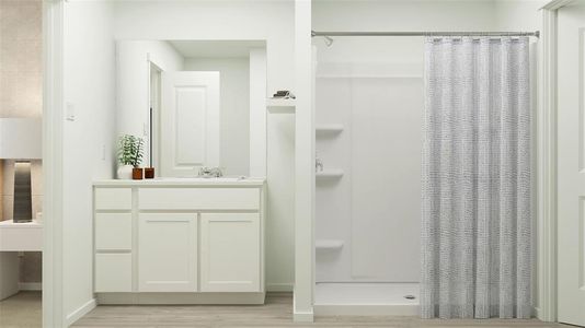 Bathroom featuring walk in shower, vanity, and hardwood / wood-style flooring