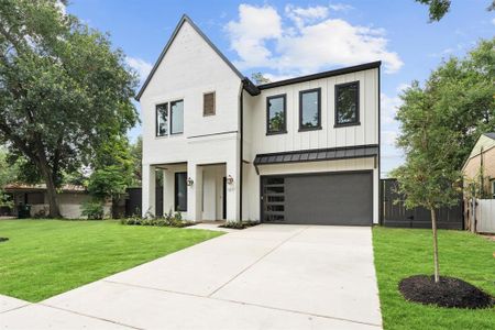 Elegant and modern design with white painted brick and dark trim.