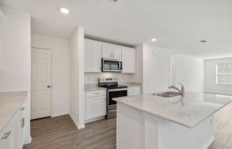 Airy kitchen with ample cabinet space *real home pictured