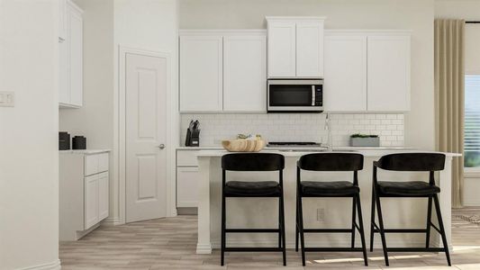 Kitchen featuring decorative backsplash, a breakfast bar, white cabinetry, and light hardwood / wood-style flooring