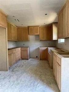 Kitchen featuring a textured ceiling