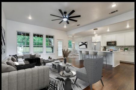 Living room featuring sink, ceiling fan, and dark hardwood / wood-style floors