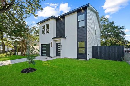 Contemporary house featuring a front lawn