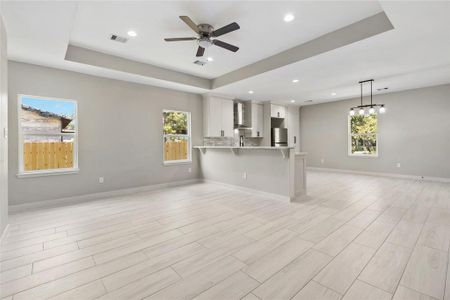 HUGE living room with a long bar for extra seating.