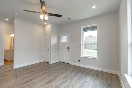 Foyer featuring ceiling fan and light hardwood / wood-style floors