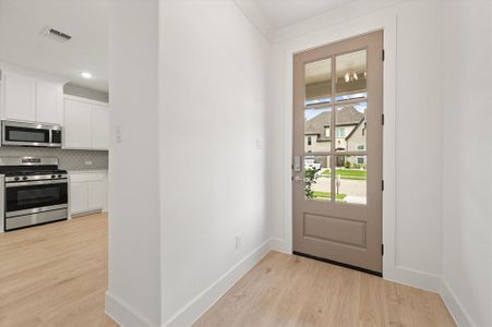 Doorway to outside with light hardwood / wood-style flooring