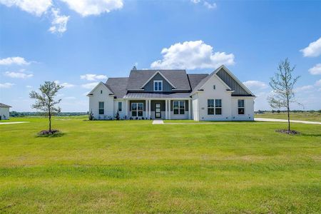 View of front of house with a front yard