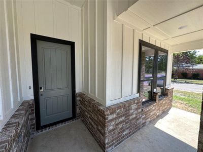 Property entrance featuring covered porch