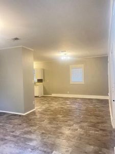 Empty room with hardwood / wood-style floors