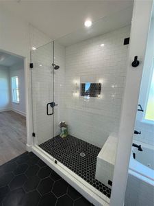 Bathroom with hardwood / wood-style flooring