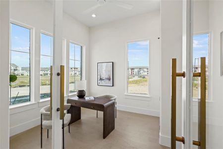 Office featuring light hardwood / wood-style floors and ceiling fan