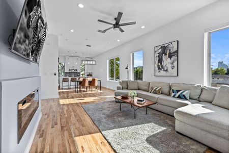 Living room with wood flooring and fireplace