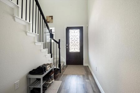 Entrance foyer featuring hardwood / wood-style flooring