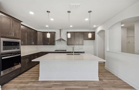 Airy kitchen with oversized island  *real home pictured