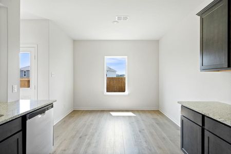 Dining area with light wood-style flooring