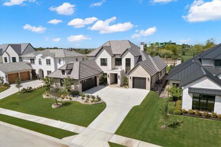 View of front of home featuring a garage and a front lawn