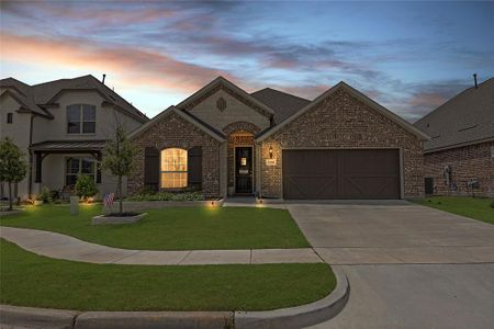 French country home with a garage and a yard