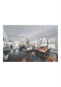 Dining space featuring hardwood / wood-style floors, ceiling fan, and lofted ceiling