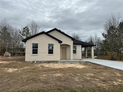 New construction Single-Family house 405 County Road 3566, Cleveland, TX 77327 - photo 0 0