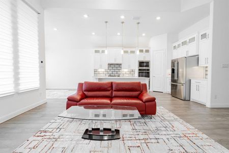 Living room with light hardwood / wood-style floors