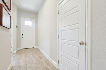 Entry way with ceramic tile and high ceilings