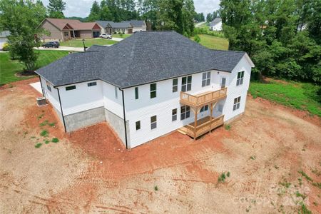 View from back showing the 1999 square foot walk out unfinished basement. Two large back decks