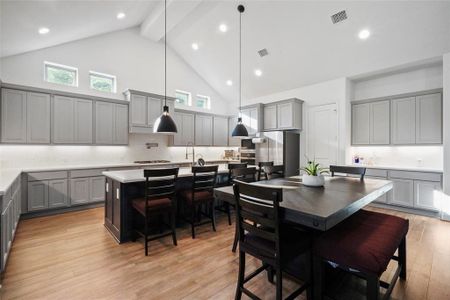 Look at this wonderful kitchen, with generous counter space, cabinets galore and beautiful pendant lighting.
