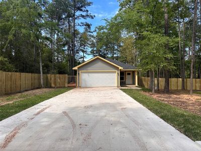 New construction Single-Family house 7984 Coral Bean Drive, Plantersville, TX 77363 - photo 1 1