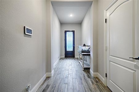 Doorway to outside featuring dark hardwood / wood-style flooring