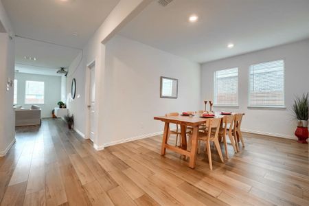 Dining area featuring light hardwood / wood-style flooring and plenty of natural light