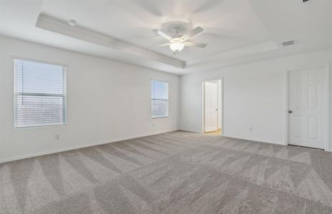 Elegant owner's suite with Tray ceiling *real home pictured