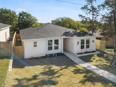 Single story home featuring a front lawn