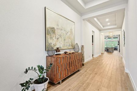 Long corridor flows into secondary bedrooms, and den.